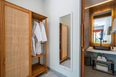 a bathroom with a sink and a mirror at Semar Villa, a cozy studio Villa with a Private Pool, Bali in Legian