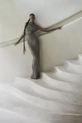 a woman standing on the side of a stairs at The Turiya - Redefining luxury in Canggu in Canggu