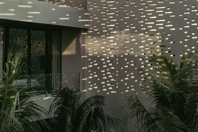 a building with a bunch of lights on the wall at The Turiya - Redefining luxury in Canggu in Canggu