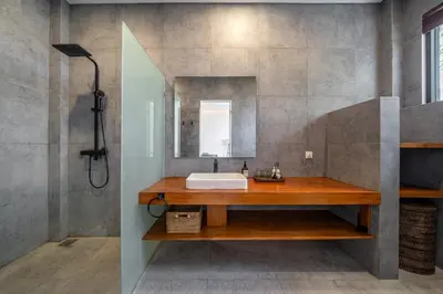 a bathroom with a sink and a mirror at Lindt - 3BR Villa with Private Pool and Ricefield View in Canggu