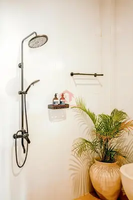 a shower in a bathroom with a plant at Luxury 3BR Umalas Villa Pool & Wi-Fi in Kerobokan