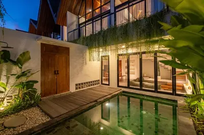 a house with a swimming pool in front of it at 2BR Villa in Canggu, Villa Sejiwa 3 in Canggu