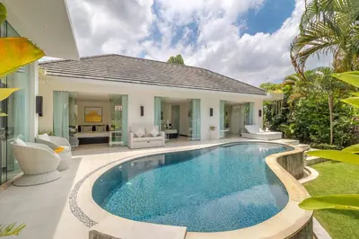 a swimming pool in the backyard of a villa at Villa Mattina, Umalas in Canggu