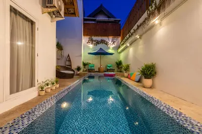 a swimming pool in the middle of a building at Villa Azure 2 - Private Pool Villa near Seminyak Centre in Seminyak