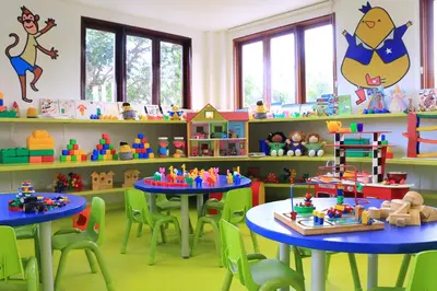 a room with two tables and chairs and toys at Montigo Resorts Seminyak in Seminyak