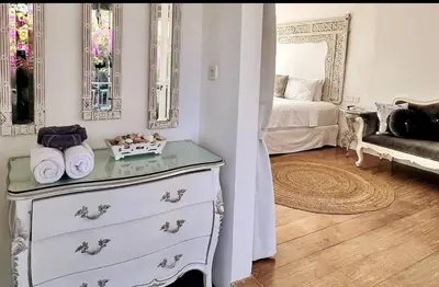 a room with a dresser and a bedroom with a bed at Villa Marabia - Charming Quiet 3BR in Seminyak in Seminyak