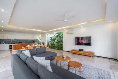 a living room with a couch and a table at Villa Aquila in Seminyak