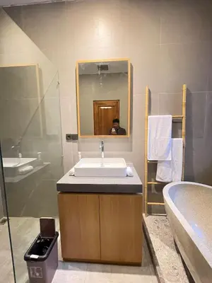 a bathroom with a sink and a mirror at Villa in South Kuta Dewi Amerta villa in Jimbaran