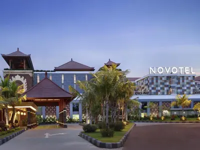 a resort with a no hotel sign on the building at Novotel Bali Ngurah Rai Airport in Kuta