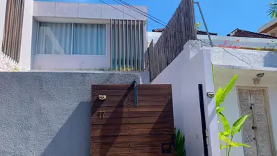 a wooden ramp leading up to a house at CS 2 Luxurious 3 BR New Villa Near Double Six Beach in Seminyak