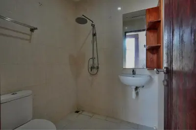 a bathroom with a toilet and a sink at NR Villa, 2 Bedroom Villa Kerobokan in Seminyak