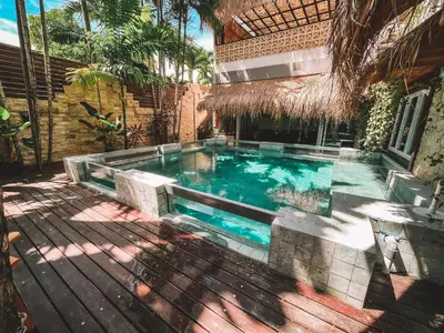 a swimming pool in the middle of a house at Villa Vela 2 BR - Vela 3 with Private Pool & Rooftop in Seminyak
