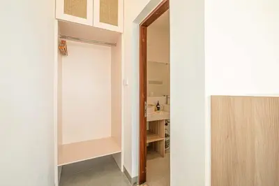 a small bathroom with a sink and a closet at Splendid Villa 3Br Center Seminyak in Seminyak