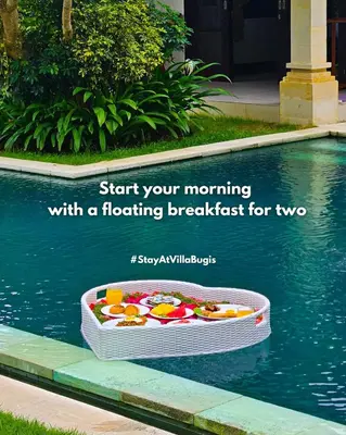 a floating basket in the water next to a pool at Arjuna Villa 3 Bedroom Villa Seminyak in Seminyak