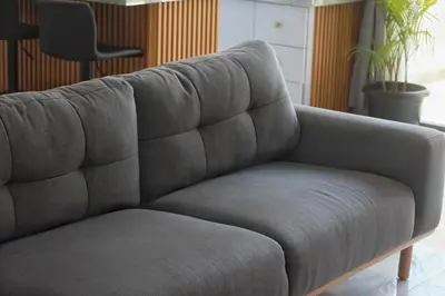 a gray couch in a living room with a chair at Villa Lisa - 3BR with pool Near Bali Mall Galleria in Kuta