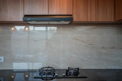 a stove top in a kitchen with a counter top at Villa Lavender Seminyak in Seminyak