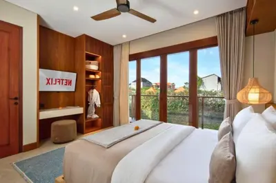 a bedroom with a large bed and a large window at Annora Cozy 3 BR Private Pool Villa in Canggu