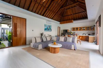 a living room with a couch and a table at Luxury 4BR Private Pool Villa, Serene Lux Jimbaran in Jimbaran