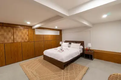 a large bedroom with a bed and a rug at Luxury 4BR Private Pool Villa, Serene Lux Jimbaran in Jimbaran