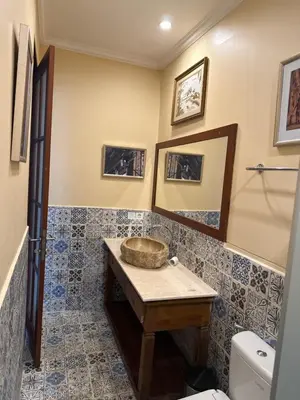 a bathroom with a sink and a toilet at Casa Sophia by Kayana in Sanur