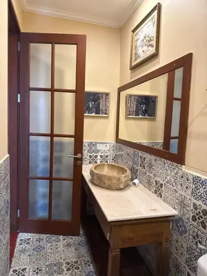 a bathroom with a sink and a mirror at Casa Sophia by Kayana in Sanur