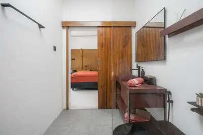 a room with a bedroom with a bed and a door at Rosso Verde 2BR Villa near Seminyak in Seminyak