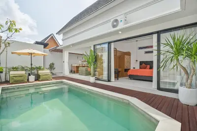 a swimming pool in the backyard of a house at Rosso Verde 2BR Villa near Seminyak in Seminyak