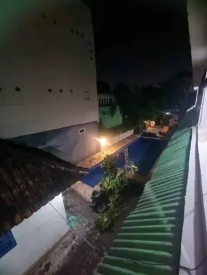 an overhead view of a pool at night at Mulia Legian guest house in Seminyak