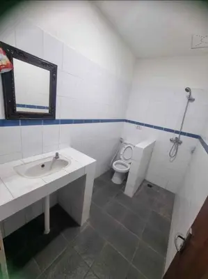 a bathroom with a sink and a toilet at Mulia Legian guest house in Seminyak