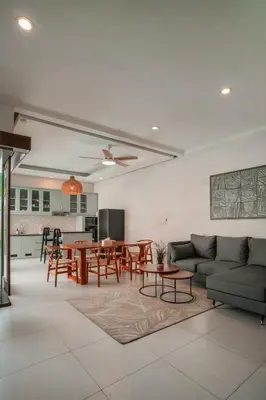 a living room with a couch and a table at Villa Aura by Maheswara in Seminyak