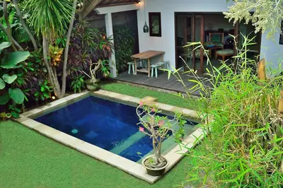 a small swimming pool in the yard of a house at Lush 1 BR Private Pool Villa inSeminyak in Kerobokan