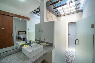 a bathroom with a sink and a mirror at Villa Dream Seminyak in Seminyak