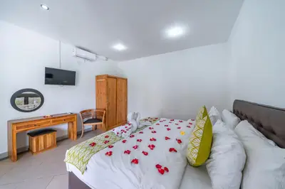 a living room with a bed and a couch at Villa Dream Seminyak in Seminyak