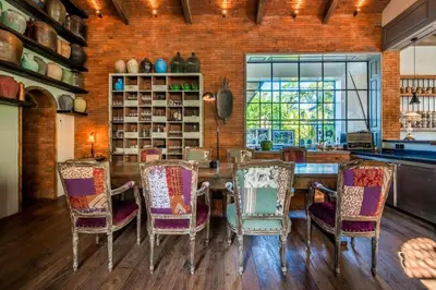 a dining room with a table and chairs at Villa Yumi by BaliSuperHost in Canggu