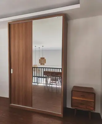 a sliding glass door in a room with a table at Bali Thousand Island in Pesanggaran
