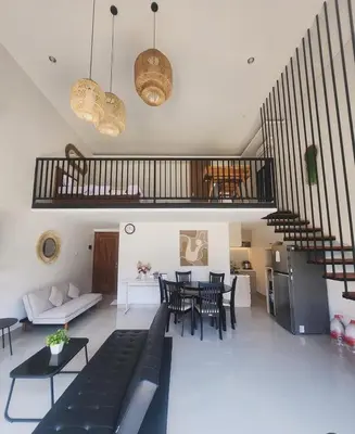 a living room with a couch and a table at Bali Thousand Island in Pesanggaran