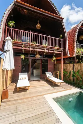 a house with a deck and a swimming pool at New Villa Uluwatu 1BR 1K with Private pool in Jimbaran