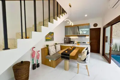 a kitchen and living room with a ping pong table at Ghayda Entire 3 BR Private Pool Villa in Seminyak