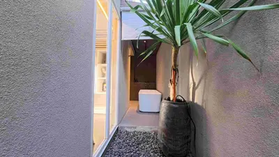 a potted plant sitting on the side of a wall at Naiika villa in Seminyak