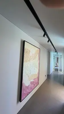 a large painting on a wall in a room at Naiika villa in Seminyak