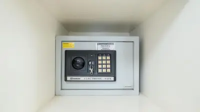 a microwave oven with a safe in a wall at Villa Merta Sari 10 by Villa Finder in Seminyak