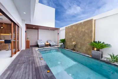 a swimming pool in the middle of a house at Zelene Elegant 3 BR Private Pool Villa in Seminyak
