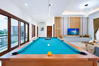 a pool table in the middle of a living room at Zelene Elegant 3 BR Private Pool Villa in Seminyak