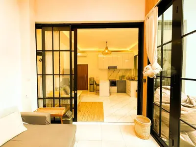 a view of a living room and kitchen from a room at Villa Mikhail Seminyak in Seminyak
