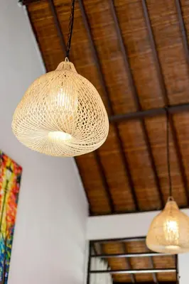 two lights hanging from the ceiling of a room at Villa Alamanda, central location and close to restaurants in Seminyak