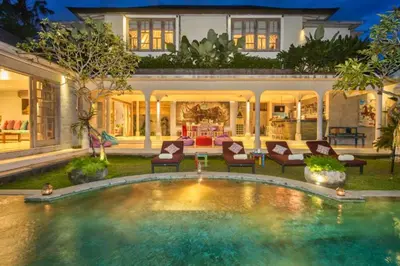 a house with a swimming pool in the yard at Kevia Peaceful 3 BR Private Pool Villa in Seminyak