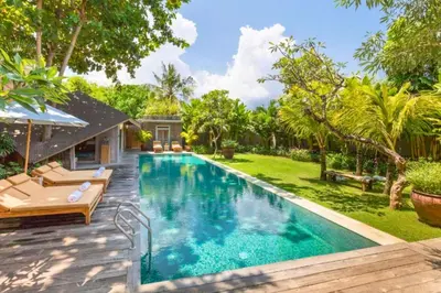 a swimming pool in the backyard of a house at Kalysta Spacious 4 BR Private Pool Villa in Canggu
