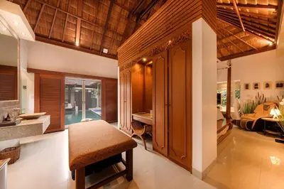 a living room with a table and a bedroom at Luxury 1BR Villa with Private Pool in Seminyak in Seminyak