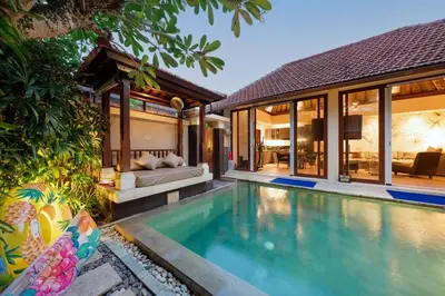 a villa with a swimming pool and a house at Luxury 1BR Villa with Private Pool in Seminyak in Seminyak