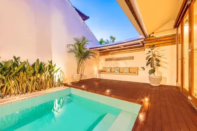 a house with a swimming pool and a patio at 3BR Villa | Seminyak Central | 450m From Beach in Seminyak